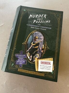 Murder Most Puzzling 500-Piece Jigsaw Puzzle - Dark Green Cover